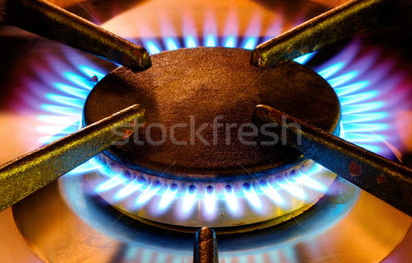 Old gas cooker hob in operation Stock photo © akarelias