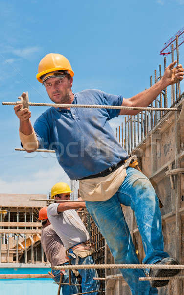 Construction workers installing formwork frames Stock photo © akarelias