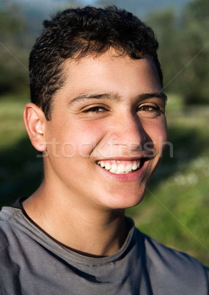Young guy smiling Stock photo © akarelias