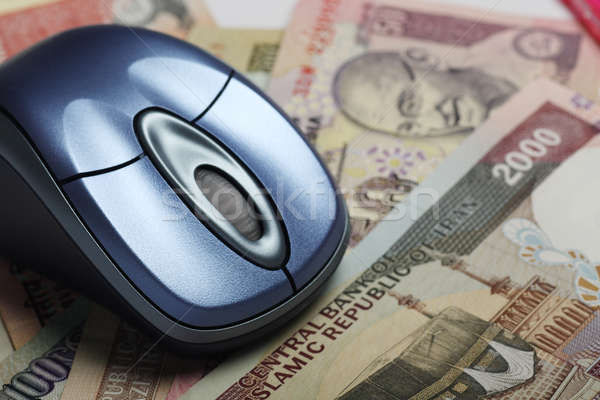 Mouse with indian and iranian currency in background Stock photo © Akhilesh