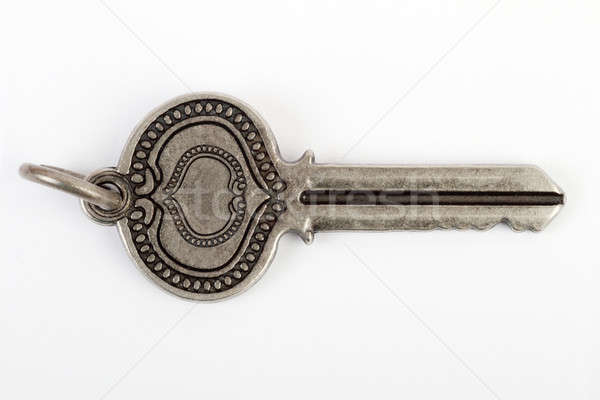 Old vintage key in white background Stock photo © Akhilesh