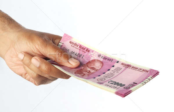 New Indian Rupee 2000 Currency Note in a Hand isolated on White Stock photo © Akhilesh