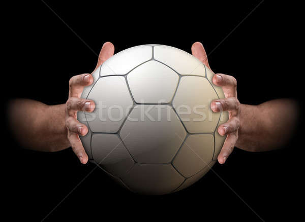 Hands Gripping Soccer Ball Stock photo © albund