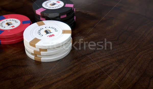 Casino chips drie waarden houten oppervlak Stockfoto © albund