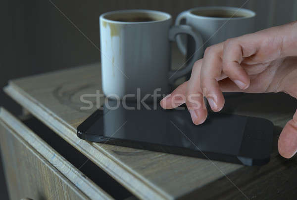 Bedside Table And Cellphone Stock photo © albund