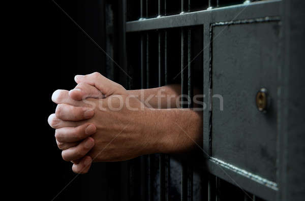 Stock photo: Jail Cell Door And Hands