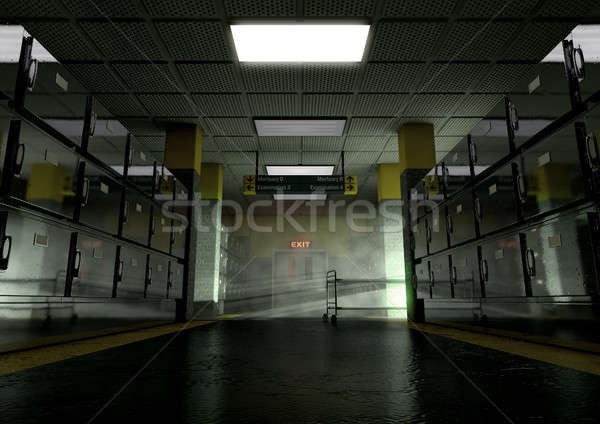 A look down the aisle of fridges of a dimly lit ward in a mortuary with an empty gerney in the dista Stock photo © albund