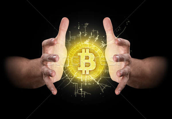 Hands Grasping Cryptocurrency Stock photo © albund