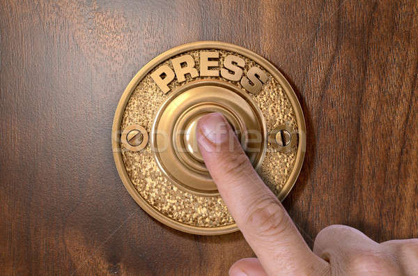 Finger Pressing Doorbell Stock photo © albund