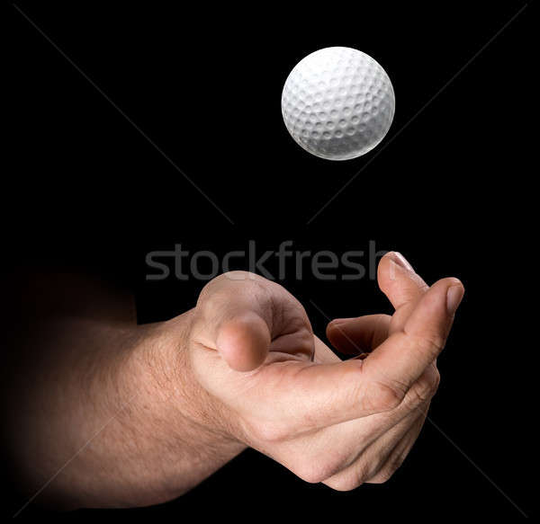 Stock photo: Hand Tossing Golf Ball