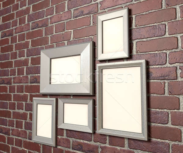 Blank Picture Frames On A Wall Perspective Stock photo © albund