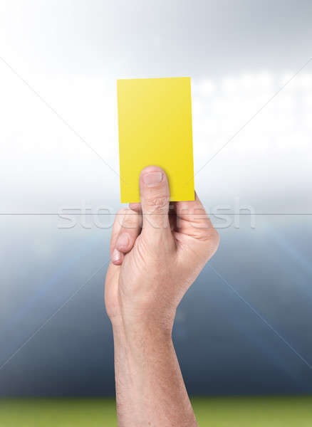 Stock photo: Yellow Card On Stadium Background