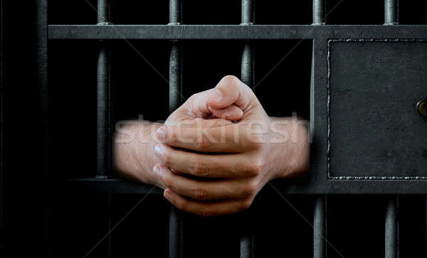 Cellule de prison porte mains prison Photo stock © albund