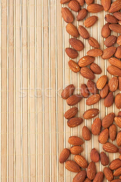 almond  lying on a bamboo mat  Stock photo © alekleks