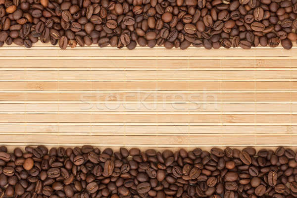 Coffee beans lying on a bamboo mat Stock photo © alekleks