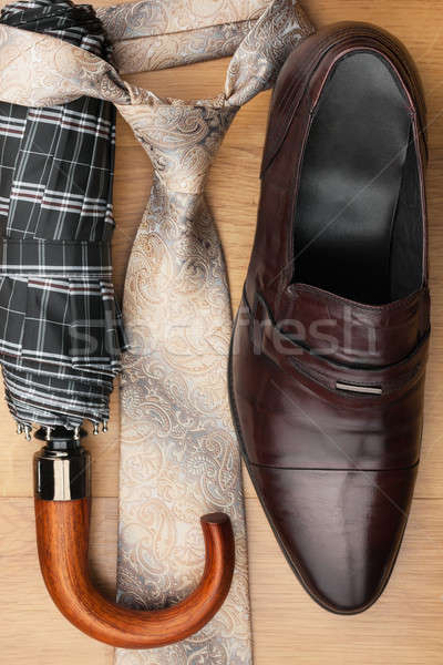 Classic men's shoes, tie, umbrella on the wooden floor Stock photo © alekleks