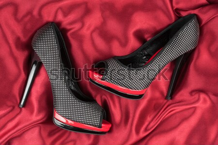 High-heeled shoes lying on white  fabric Stock photo © alekleks