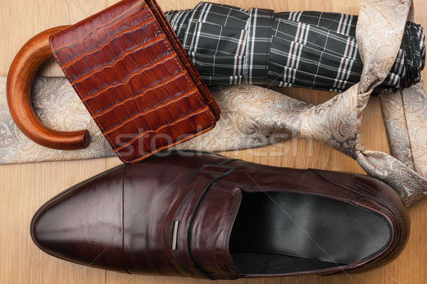 Classic men's shoes, tie, wallet, umbrella on the wooden floor Stock photo © alekleks
