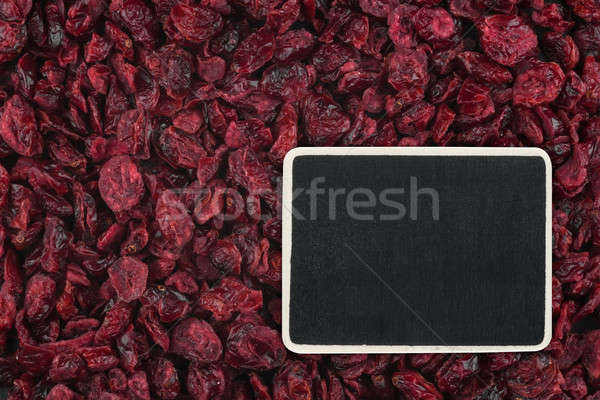 Pointer, the price tag lies on dried  cranberry Stock photo © alekleks