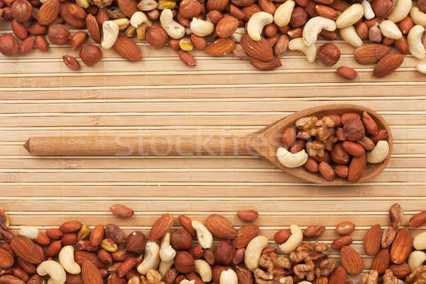 Stock photo: Wooden spoon with  dried  nuts