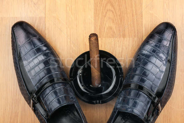 Classic men's shoes, ashtray and  fuming cigar on the wooden flo Stock photo © alekleks