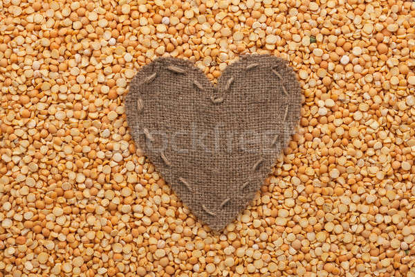Frame in the shape of heart made of burlap with dry peas Stock photo © alekleks