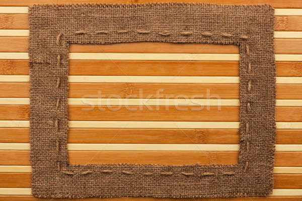 Frame of burlap, lies on a bamboo mat Stock photo © alekleks