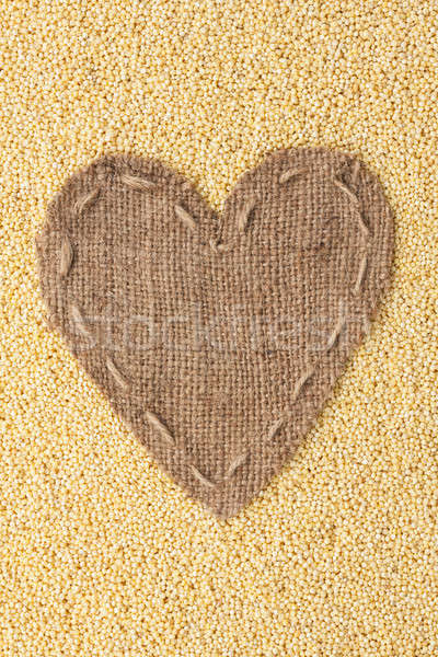 Frame in the shape of heart made of burlap with millet Stock photo © alekleks