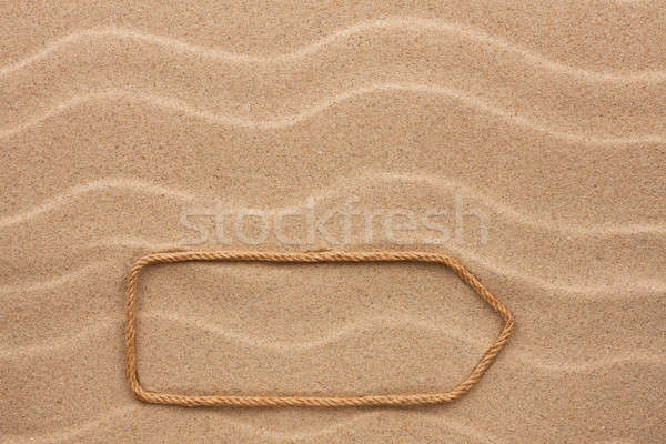 Pointer made of rope on the sand Stock photo © alekleks