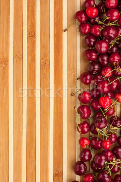 Cherry lying on bamboo mat Stock photo © alekleks