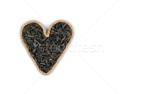 Sembolik kalp halat ayçiçeği tohumları beyaz Stok fotoğraf © alekleks