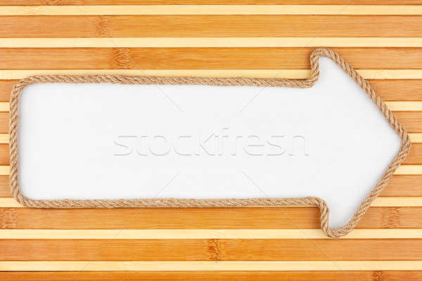 Pointer made of rope with a white background on the bamboo mat Stock photo © alekleks