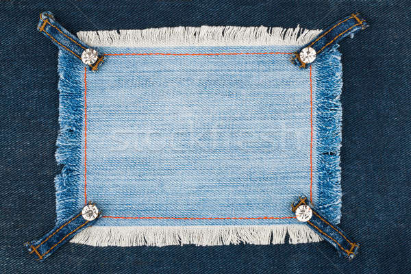Frame with four straps jeans and rhinestones, lies on the dark denim Stock photo © alekleks