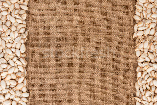 Stock photo: Pumpkin seeds were lying on sackcloth