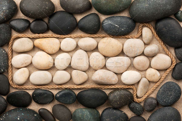 Pointer made of rope with white and black stones Stock photo © alekleks