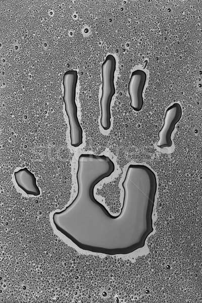 Handprint man out of the water Stock photo © alekleks