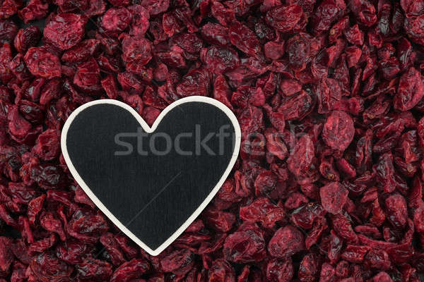 Heart pointer, the price tag lies on dried cranberry Stock photo © alekleks