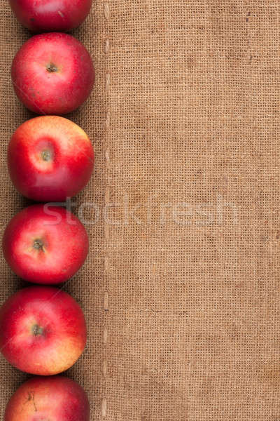 Red apples lie on sackcloth Stock photo © alekleks