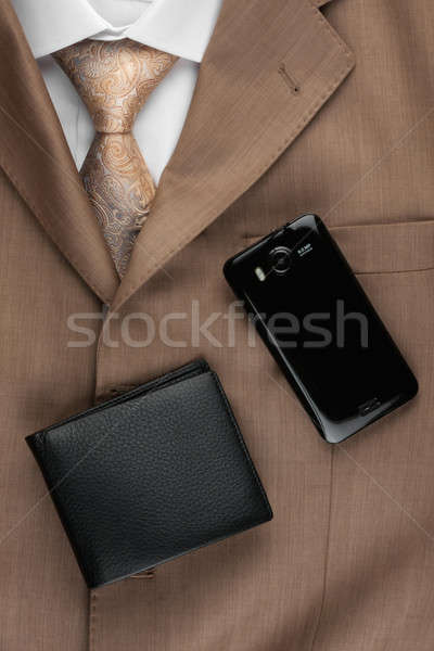 Purse and phone lying on the suit and tie Stock photo © alekleks