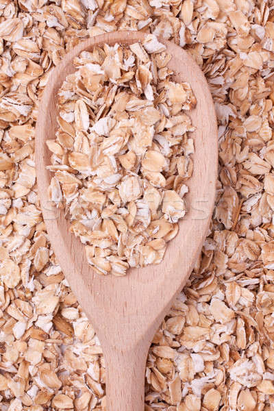 oat-flakes with a wooden spoon Stock photo © alekleks