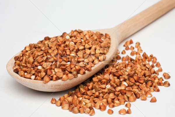 Buckwheat with a wooden spoon Stock photo © alekleks