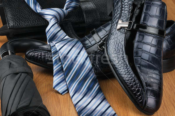 Classic men's shoes, tie, umbrella and bag on the wooden floor Stock photo © alekleks
