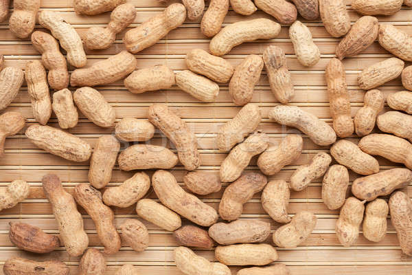 Peanut  lying on a bamboo mat Stock photo © alekleks