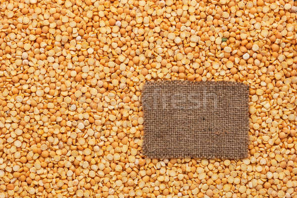 Tag made of burlap lies against the backdrop of peas Stock photo © alekleks