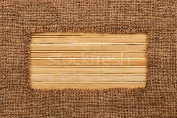 Frame made of burlap lying on a bamboo  mat Stock photo © alekleks