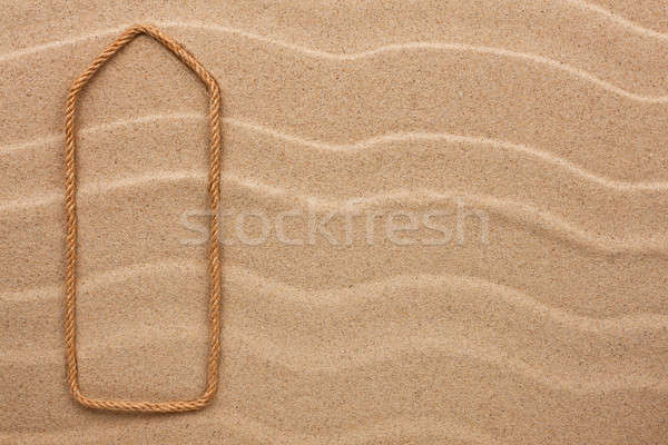 Pointer made of rope on the sand Stock photo © alekleks