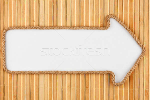 Pointer made of rope with a white background on the bamboo mat Stock photo © alekleks