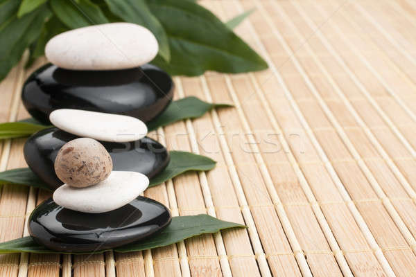 Spa concept with zen stones and leaves  Stock photo © alekleks