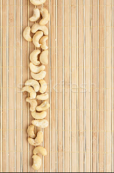 Cases a band of  cashew   lying on bamboo mat Stock photo © alekleks