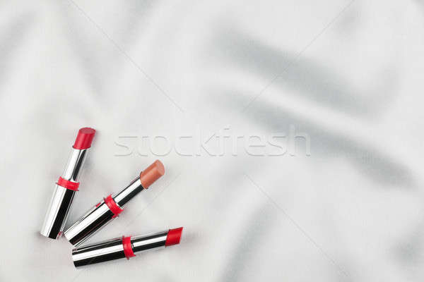 Beautiful picture of cosmetic  on white satin Stock photo © alekleks
